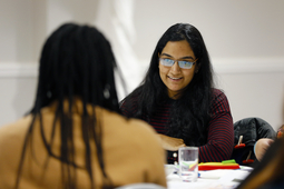 Woman smiling to other worman